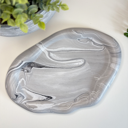 Marble-patterned stone decor piece on a light background with text about eco-friendly stoneware and sustainable home decor.