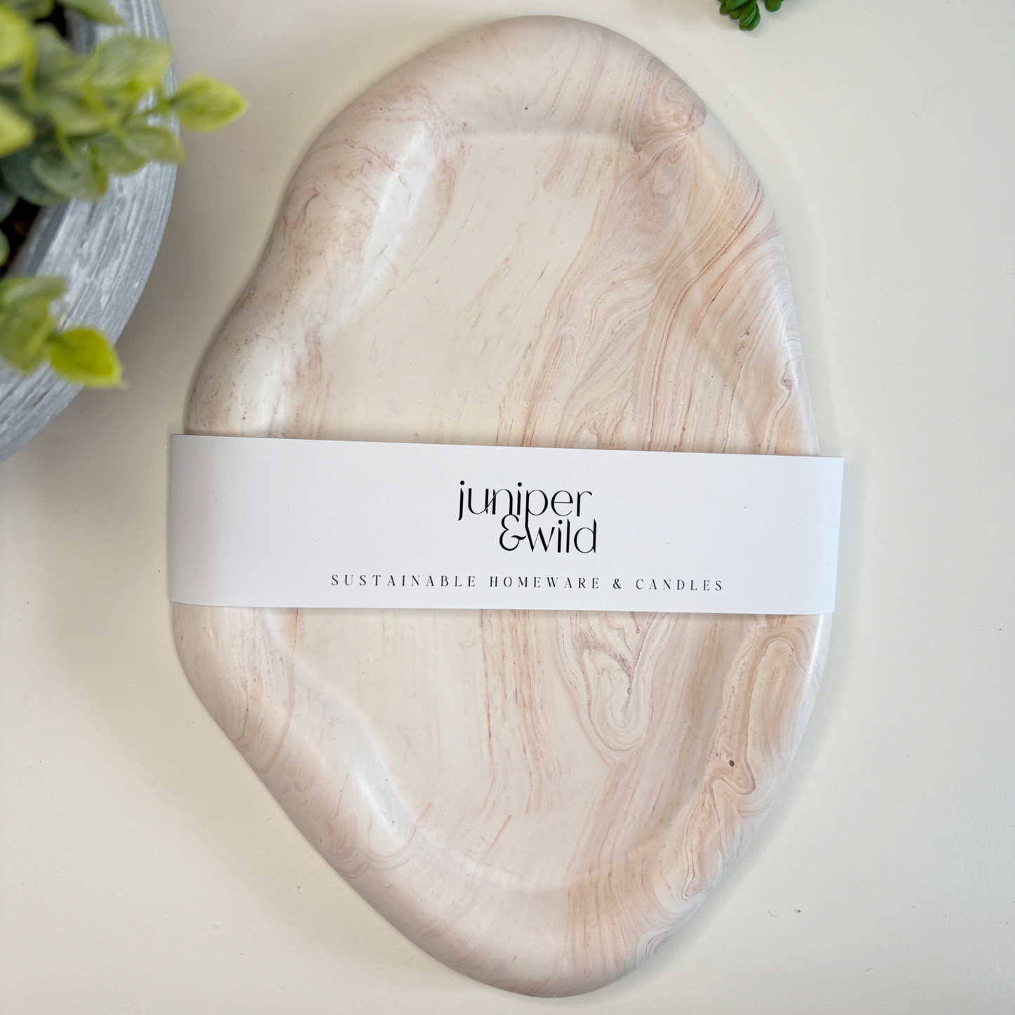 Marble effect decorative tray with Juniper & Wild label 