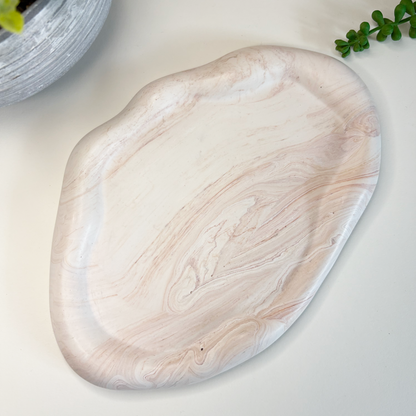 Eco-friendly stoneware plate on a light background with text about sustainable home decor.