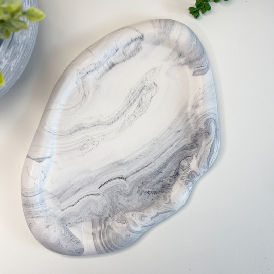Marble-patterned stone on a light background with text about eco-friendly stoneware and sustainable home decor.
