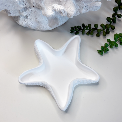 Star-shaped ceramic dish on a light surface with text about eco-friendly stoneware and sustainable home decor.
