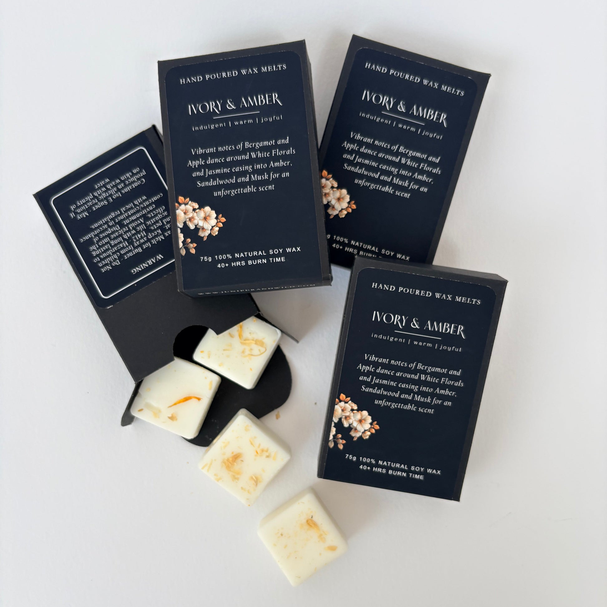 Boxes pf Ivory & Amber Wax Melts with an open box showing some melt cubes